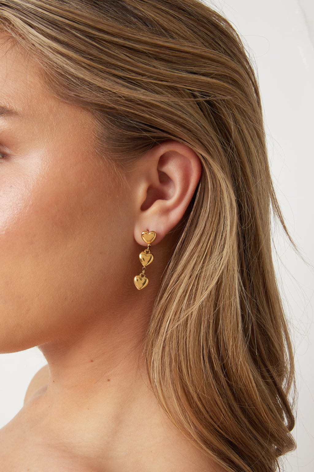 Boucles d'oreilles avec 3 cœurs pendants