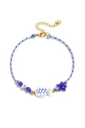 Bracelet de cheville orné d'un motif de corde, de perles en forme de poisson et d'étoile.