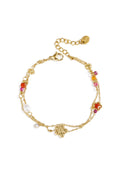 Bracelet à breloques en forme d'étoile et de fleur et de perles