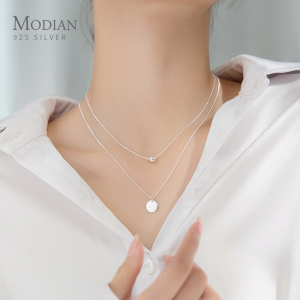 Collier double rang perles et pièces de monnaie